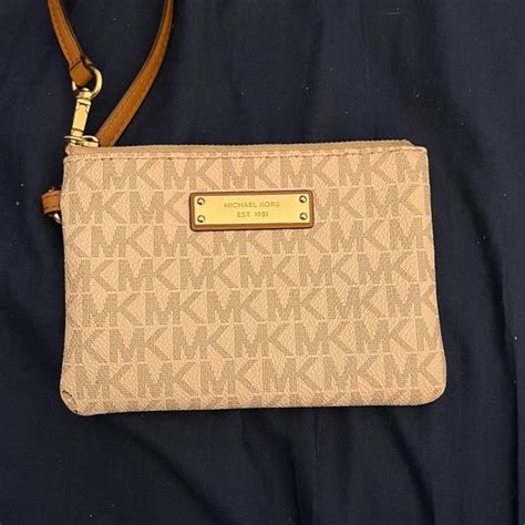 how much is a michael kors change purse worth|Michael Kors guarantee on purses.